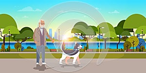 Senior man walking with husky dog urban city park background grandfather with his animal pet best friend concept