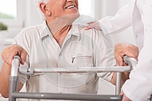 Senior man with walking zimmer