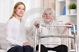 Senior man with walking zimmer photo