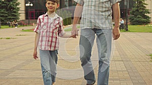Senior man walks with his grandson outdoors