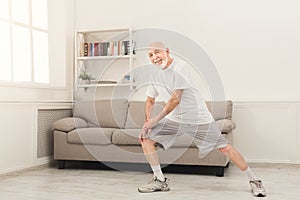 Senior man warmup stretching training indoors