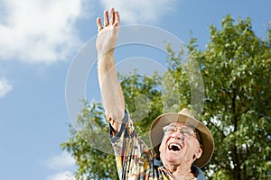 Senior man waving