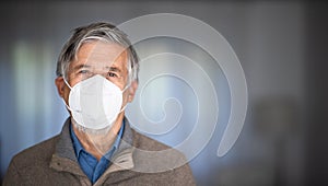 Senior man wearing  a facemask during coronavirus and flu outbreak photo