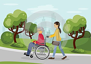 Senior man in wheelchair with careful woman