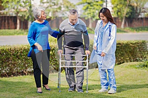 Senior man on wheelchair with doctor and wife