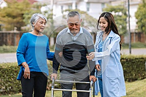 Senior man on wheelchair with doctor and wife