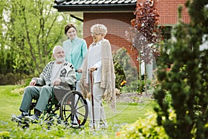 Senior man on the wheelchair in the garden of nursing home