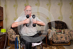 Senior Man in Wheelchair Lifting Dumbbells at Home