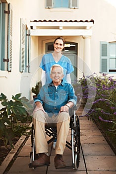 Senior man, wheelchair and portrait of nurse in healthcare support or garden walk at nursing home. Happy elderly male