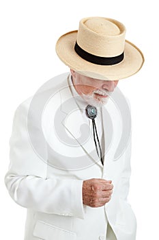 Senior Man in White Suit and Panama Hat