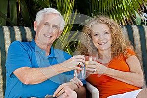 Senior Man and Woman Couple Enjoying Drinks