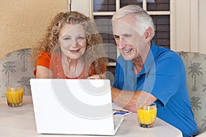 Senior Man and Woman Couple On Laptop Computer