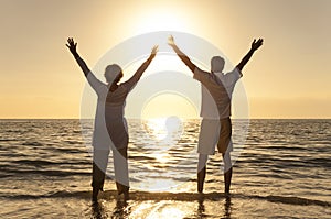 Senior Man & Woman Couple Sunset on Beach