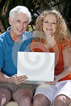 Senior Man & Woman Couple Using Laptop Computer