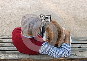 A senior man and woman hand using a touchscreen cell phone