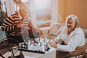 Senior Man and Woman Play Chess. Nursing Home.