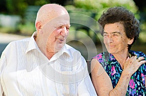 Senior man and woman smoking