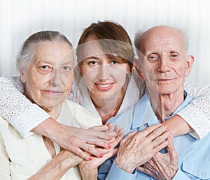 Senior Man, Woman with their Caregiver at Home.