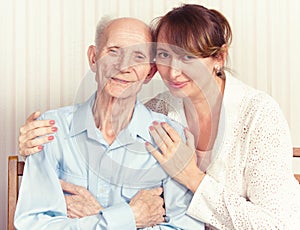 Senior Man, Woman with their Caregiver at Home.