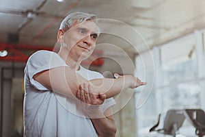 Senior man working out at the gym