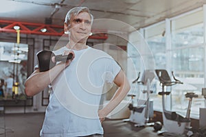 Senior man working out at the gym