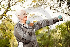 Senior man working out in park