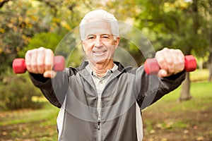 Senior man working out in park