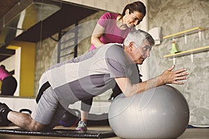 Senior man workout in rehabilitation center. photo