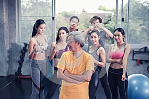 Senior man and young group people, Friends different ages in gym working out