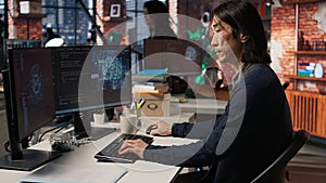 Senior manager drinks coffee while working in software development agency