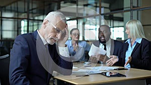 Senior manager feeling tired of arguing colleagues office, work stress, burnout