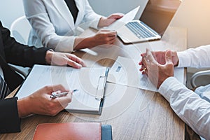 Senior manager HR reading a resume during a job interview employee young man meeting Applicant and recruitment