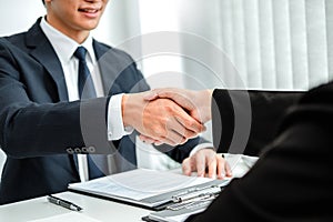 Senior manager HR reading a resume during a job interview employee young woman meeting Applicant and recruitment. Interview