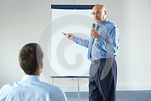 Senior manager during presentation photo