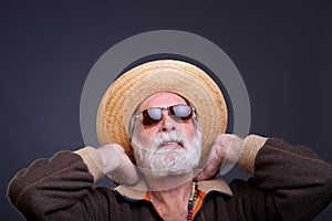Senior mand with straw hat. photo