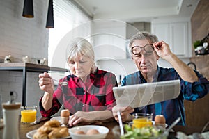 Senior marriage having morning breakfast together