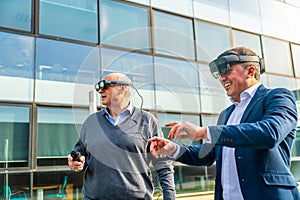 Senior and mature businessmen using the VR headset with actions