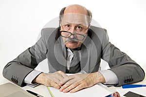 Senior mature busy business man with bald head on his 60s working stressed and frustrated at office computer laptop desk