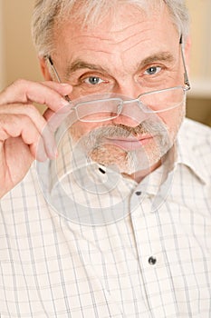 Senior mature man thoughtful with glasses