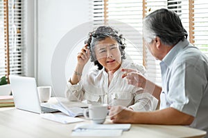 Senior mature man and woman having problem about family Financial crisis