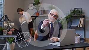 Senior mature old business man pointing to camera, choosing lucky one winner, meaning we need you