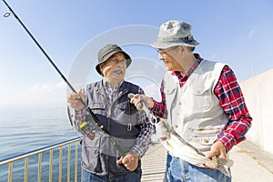 Senior men enjoying lure fishing