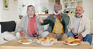 Senior, men and upset for sport on tv with food, angry and shouting on sofa in living room. Friends, elderly people and