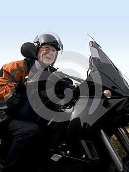 Senior on a motorbike