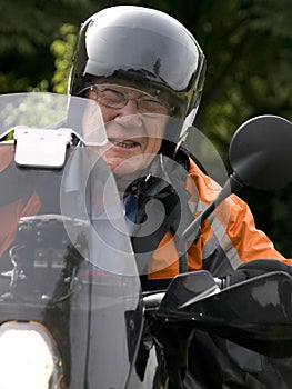 Senior on a motorbike