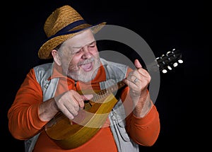 Senior musician with mandolin playing and singing country music