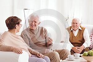 Senior neighbors talking