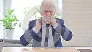 Senior Old Businessman in Pain Massaging His Neck