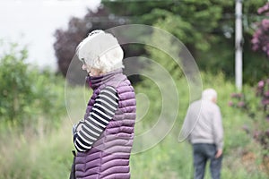 Senior old couple together with dementia brain disease feel sad and loss of love