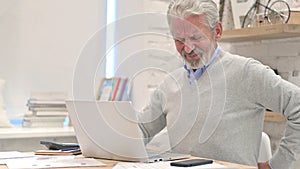 Senior Old Man with Spinal Back Pain at Work